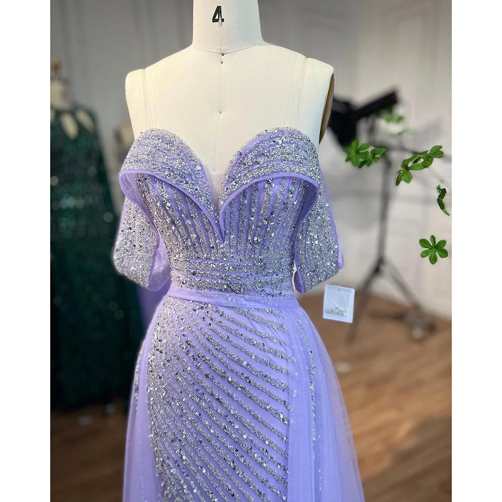 Lavender evening gown with beading on a mannequin in a store setting.
