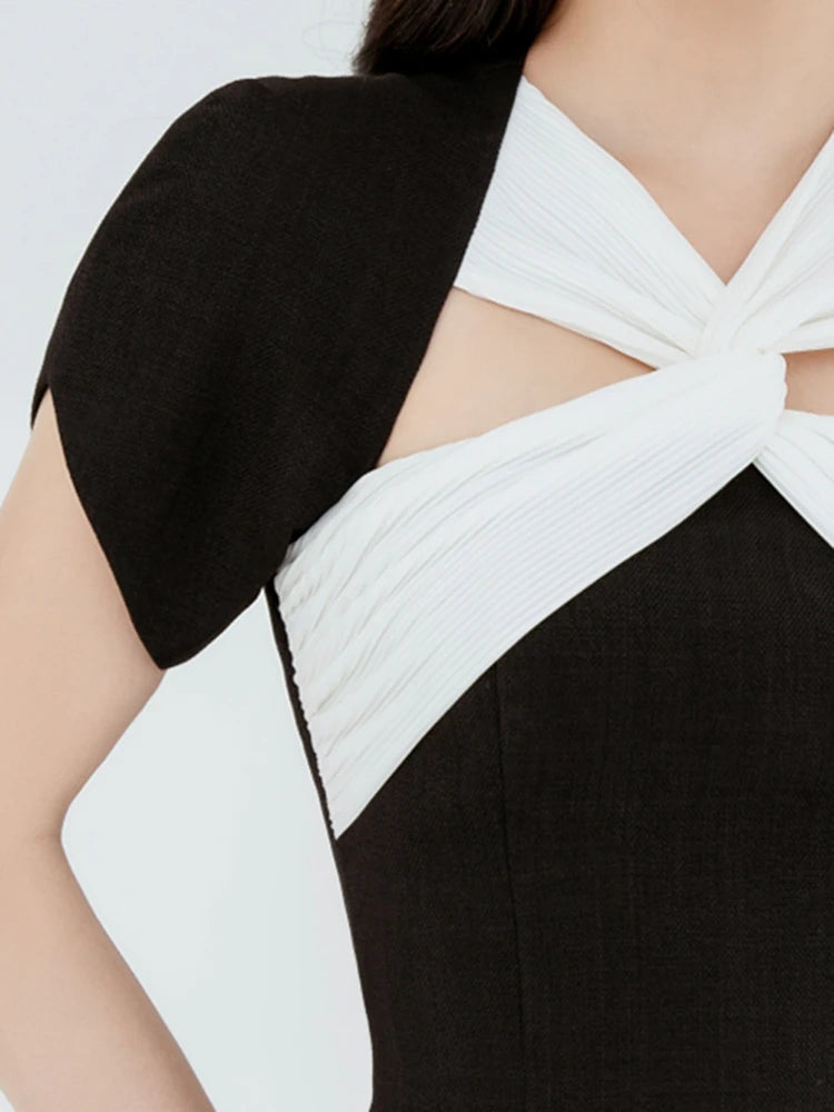 Black and white dress with a geometric pattern on a light gray background