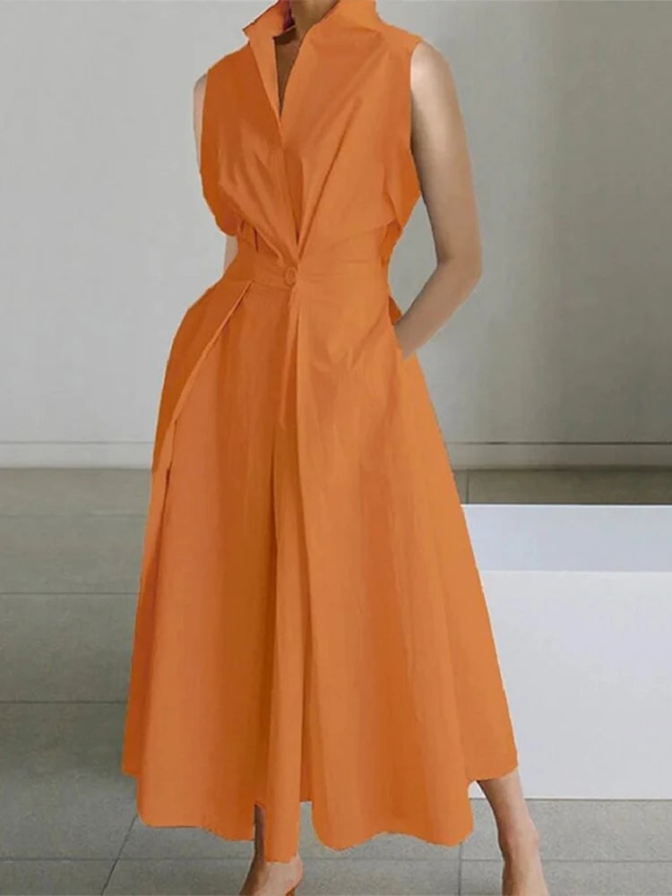 Orange sleeveless dress worn by a person on a neutral background