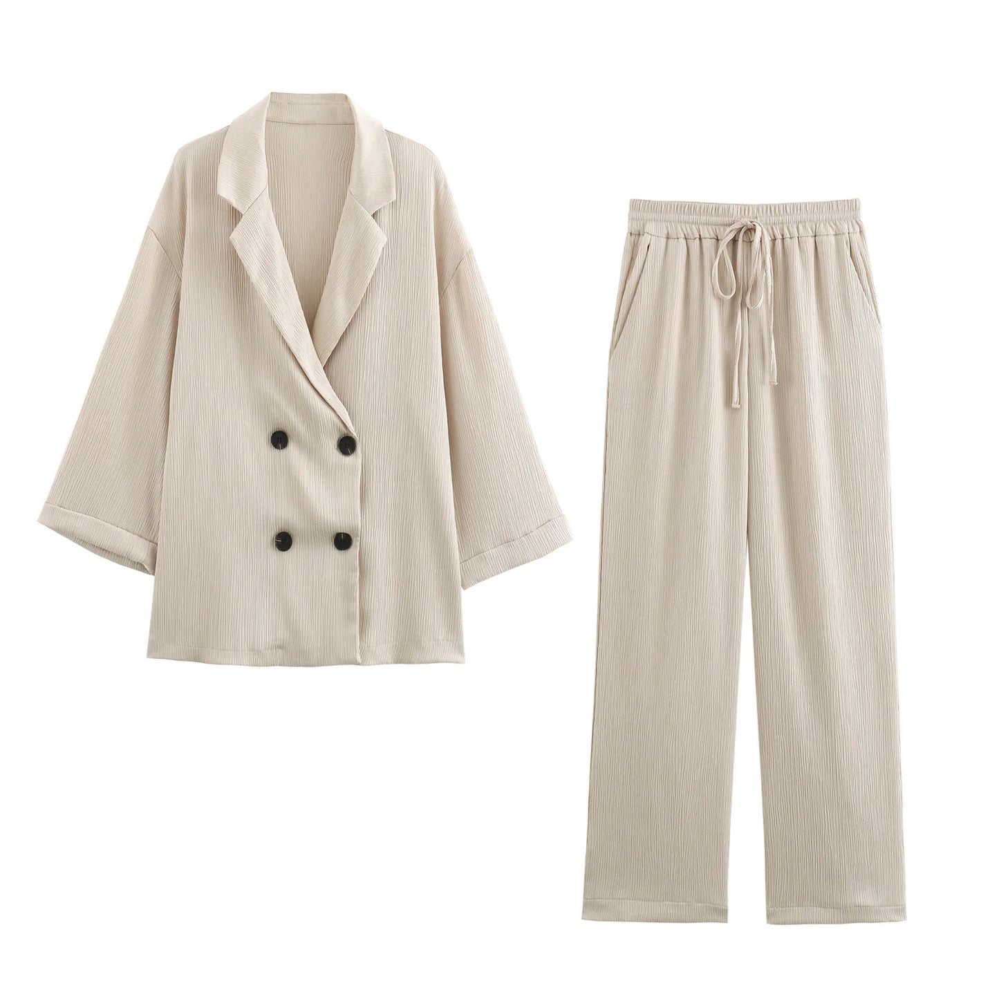 Beige blazer and pants set on a white background