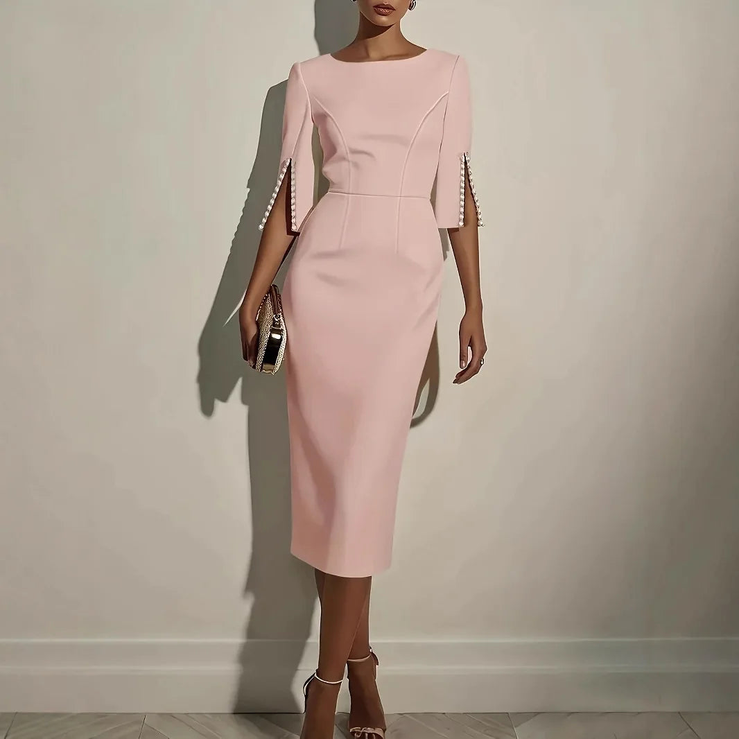 Pink dress with unique sleeve design on a plain background