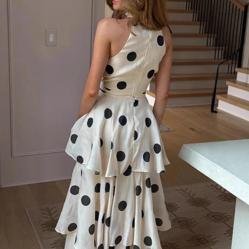 Woman wearing a polka dot dress in a home setting