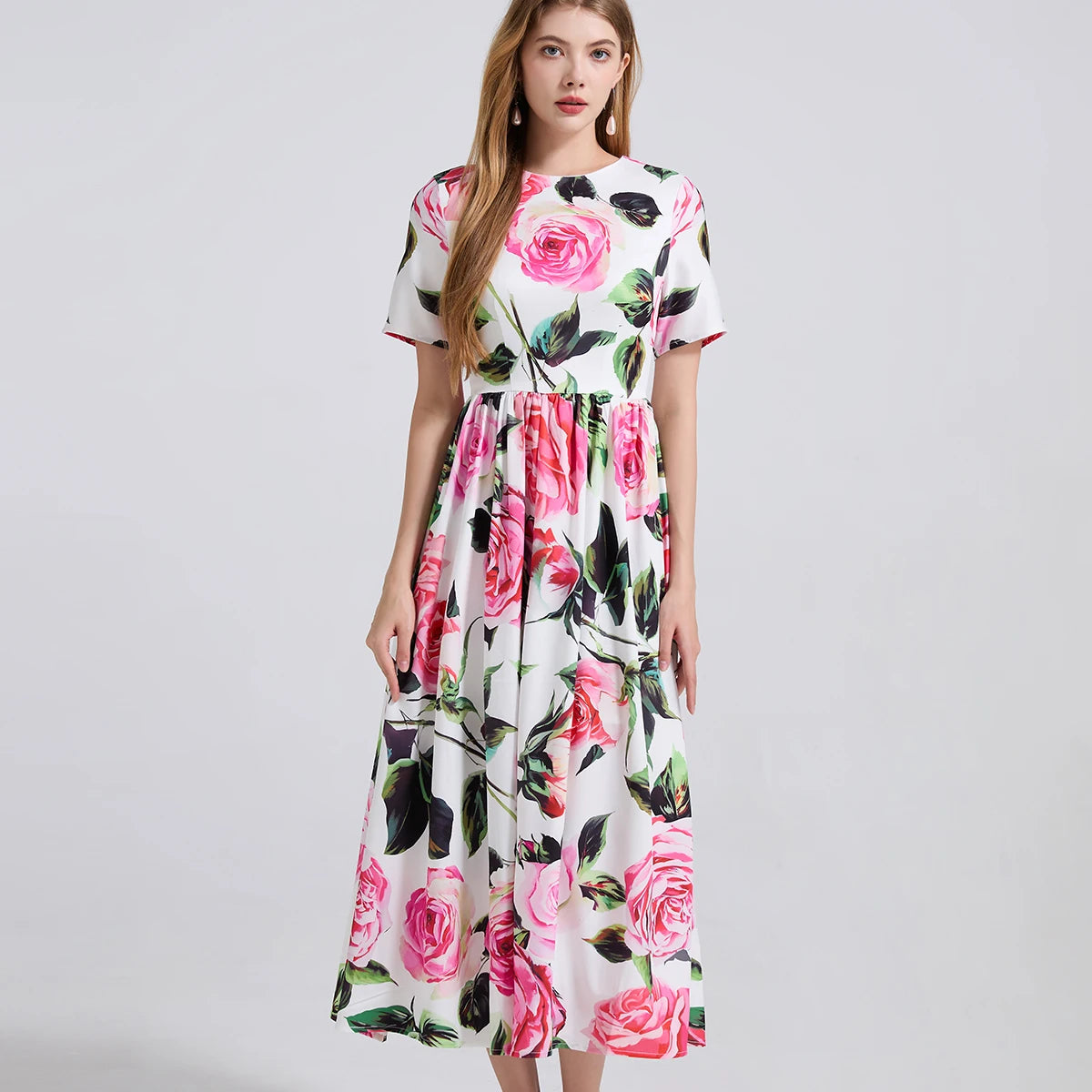 Woman wearing a floral dress on a gray background