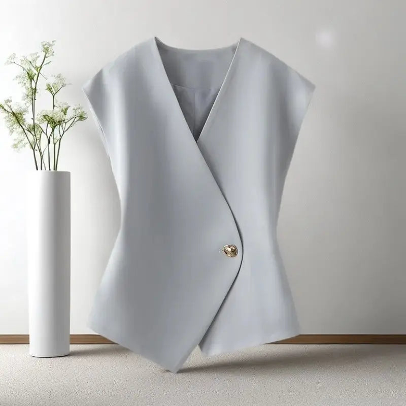 Light gray vest with a single button on a white background