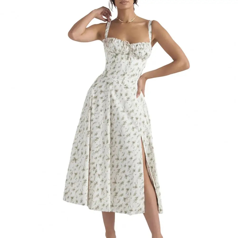 Woman wearing a white floral dress with a slit on a white background
