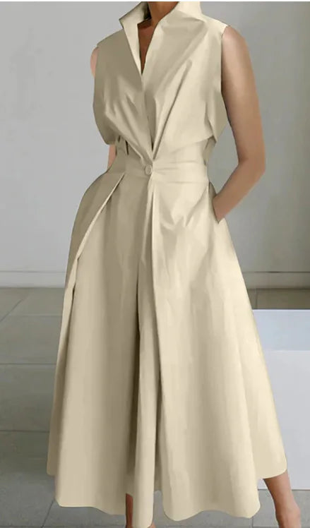 Beige sleeveless dress worn by a person on a neutral background