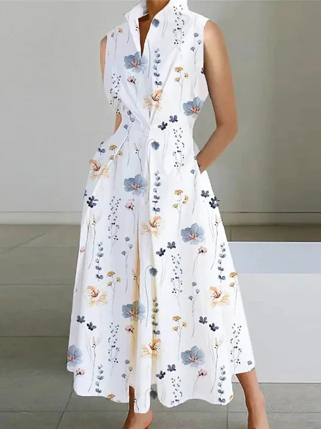 White floral dress worn by a person on a neutral background