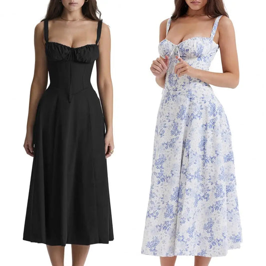 Two dresses, one black and one floral, on a white background