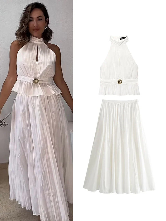 Woman wearing a white dress with a close-up of the dress on a white background