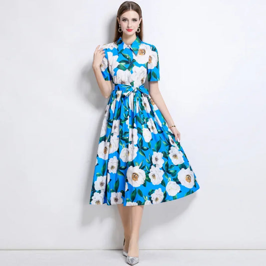 Woman wearing a blue floral dress on a white background