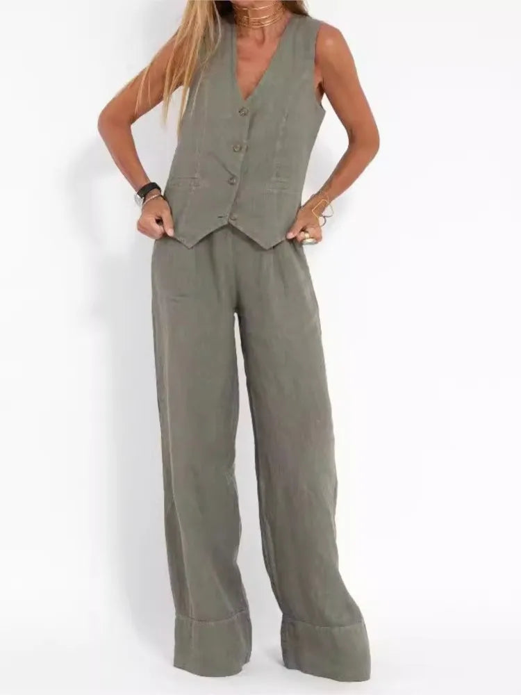 Person wearing a green vest and wide-leg pants on a white background