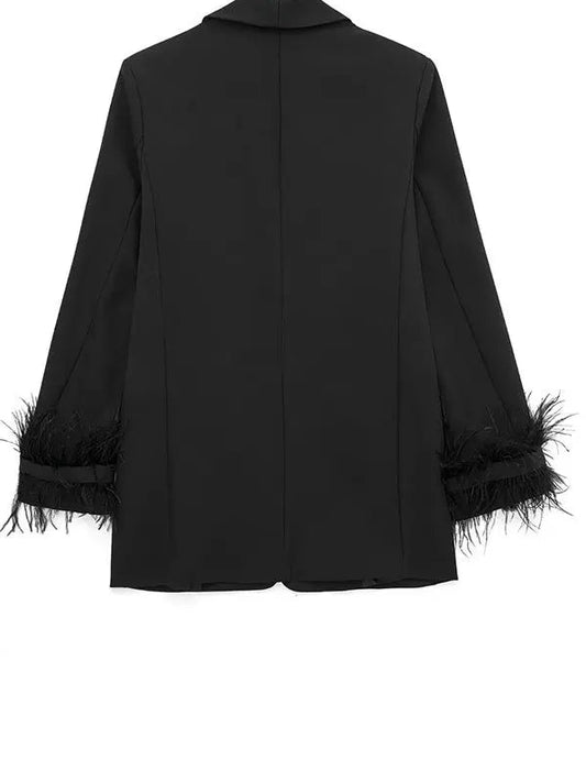 Black jacket with feathered cuffs and hem on a white background, branded 'Willsheela'.