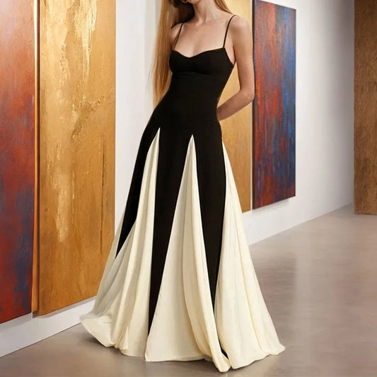 Woman wearing a black and white dress in an art gallery setting