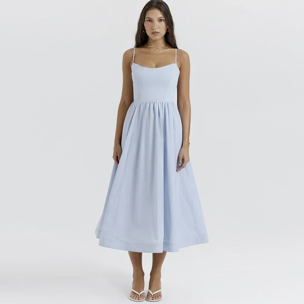 Woman wearing a light blue dress on a white background