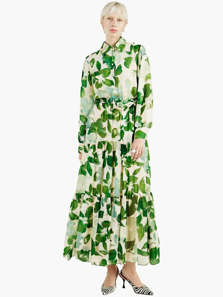 Woman wearing a green leaf-patterned dress on a white background
