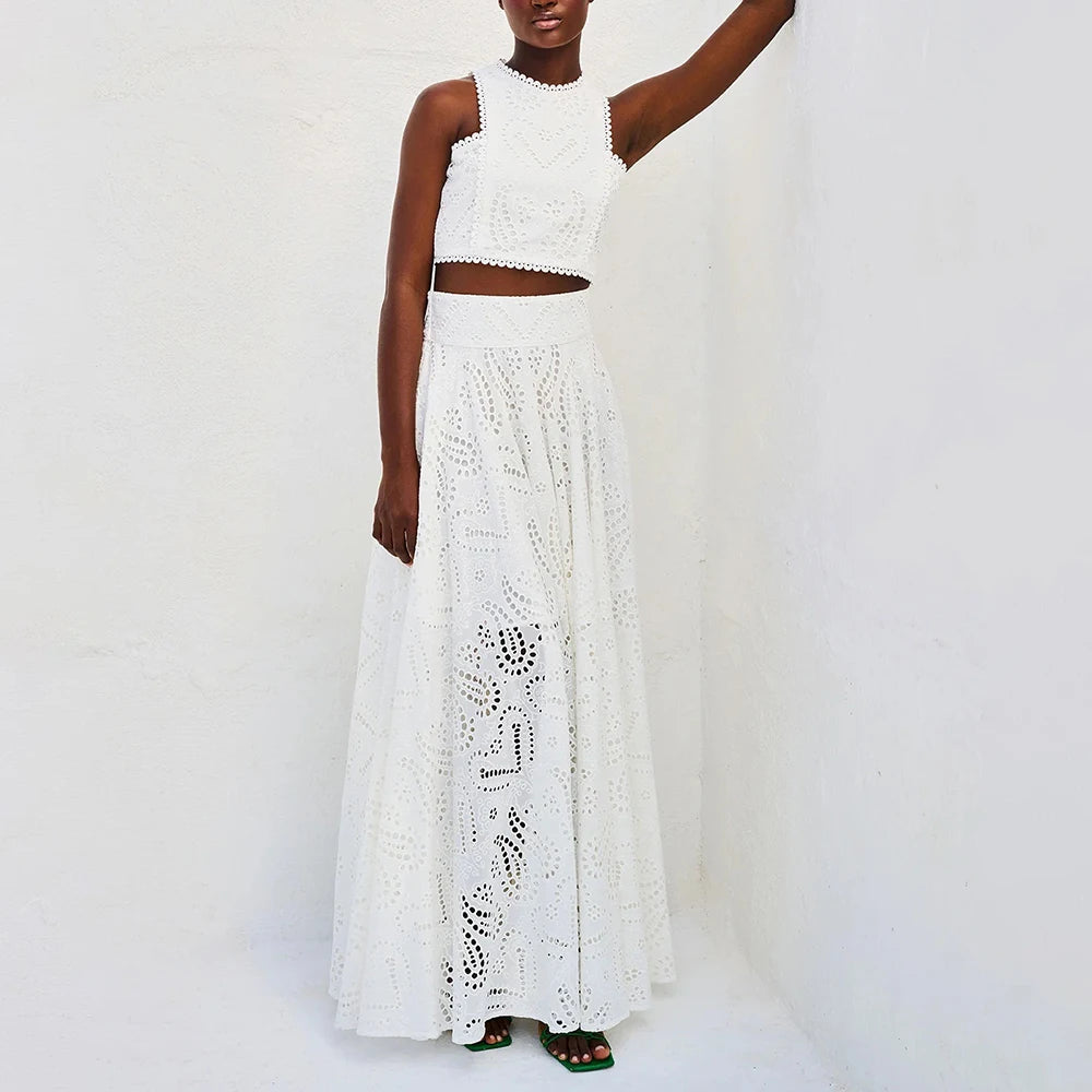 White lace dress worn by a model on a white background