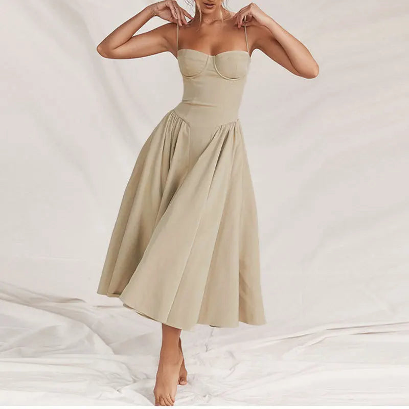 Beige dress worn by a model on a white background