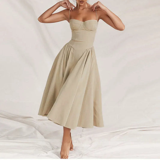Beige dress worn by a model on a white background