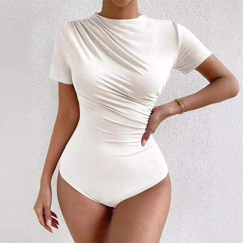 White bodysuit worn by a model on a light gray background