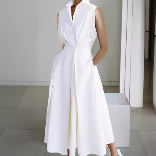 White sleeveless dress worn by a person in an indoor setting