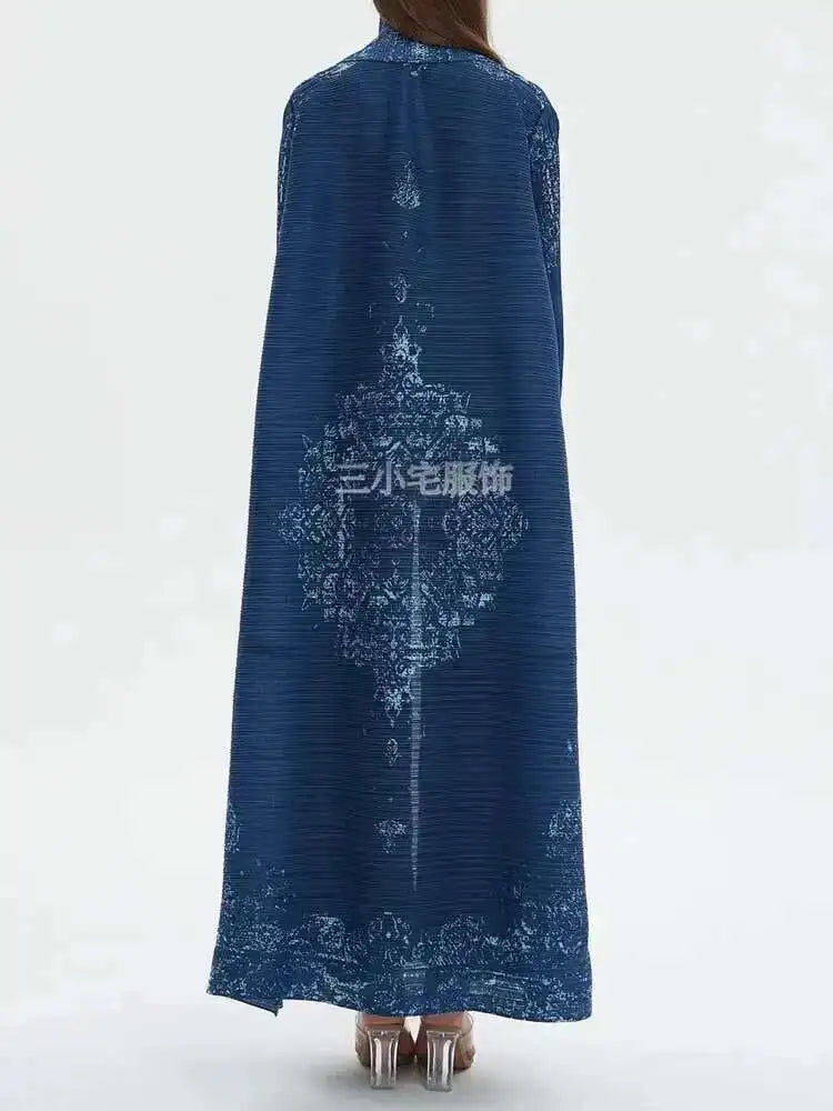 Blue dress with intricate patterns on a white background