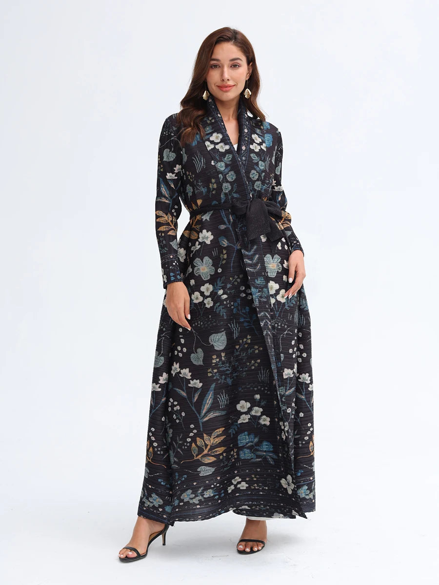 Woman wearing a long floral dress on a white background