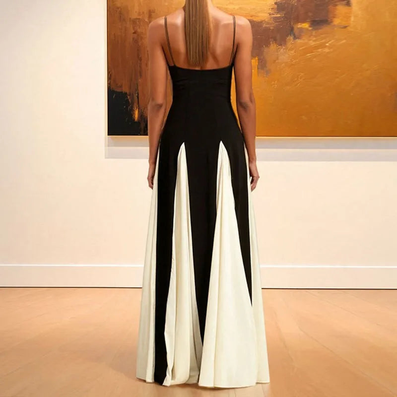 Woman wearing a black and white dress in an art gallery setting