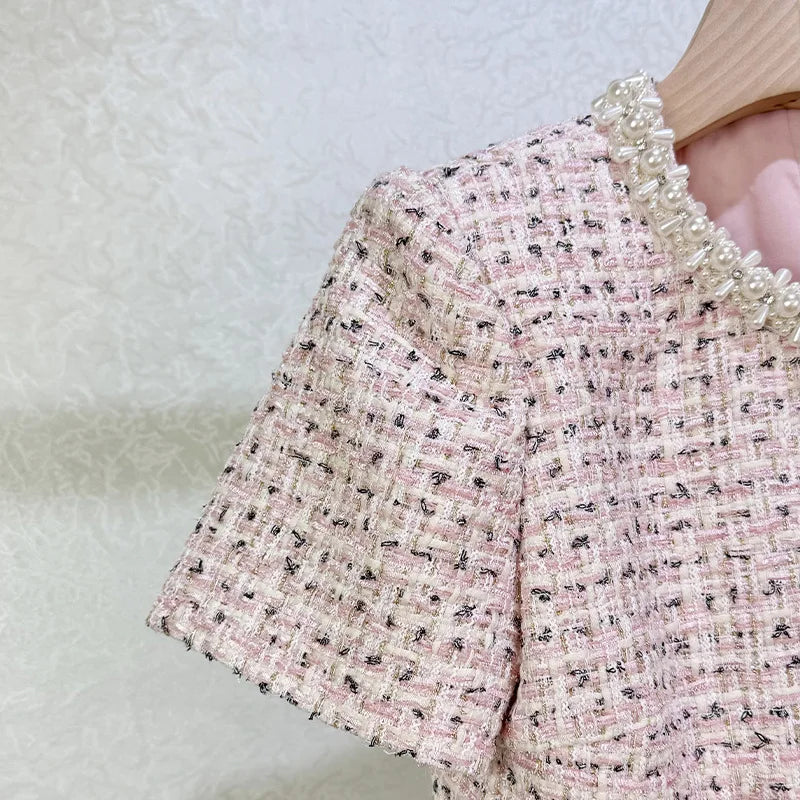 Close-up of a textured pink fabric with a blurred background
