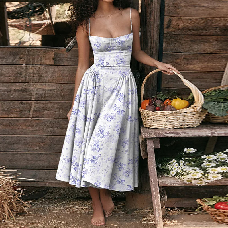 Woman in a floral dress holding a basket of vegetables against a wooden wall.