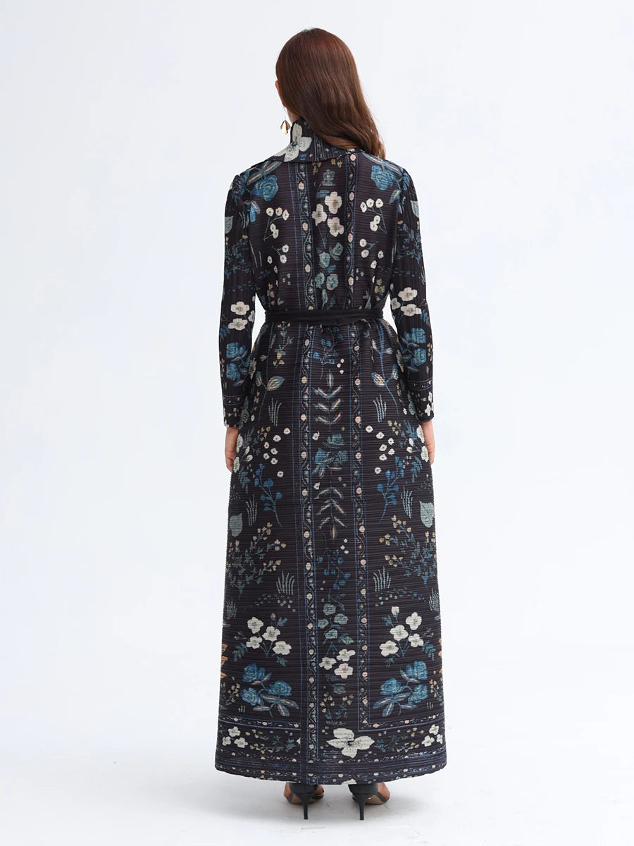 Woman wearing a long floral dress with a white background