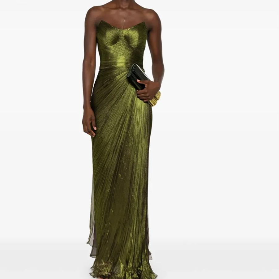 Woman wearing a green strapless evening gown on a white background