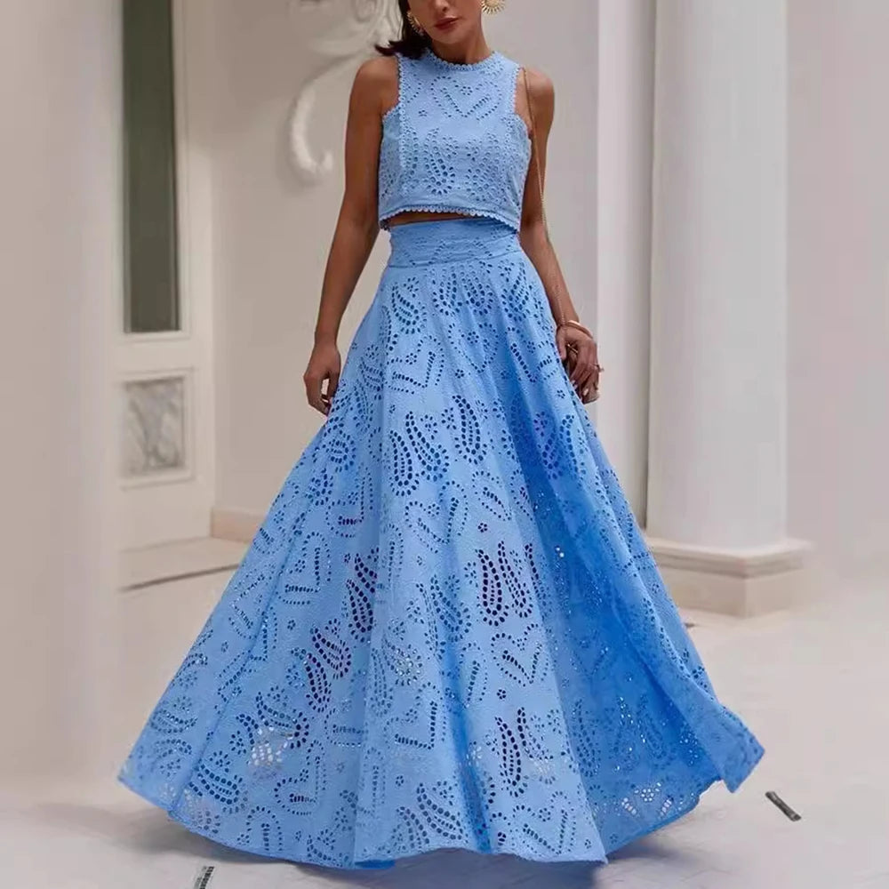 Woman wearing a blue lace two-piece outfit in an indoor setting