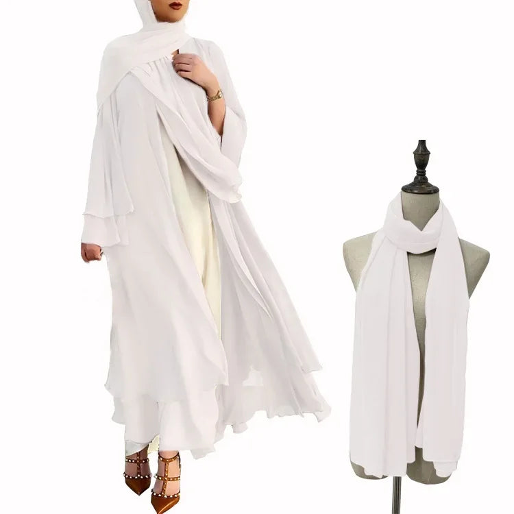 White abaya with matching scarf on a mannequin and person against a white background