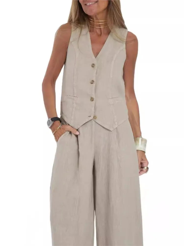Woman wearing a beige vest and wide-leg pants on a white background