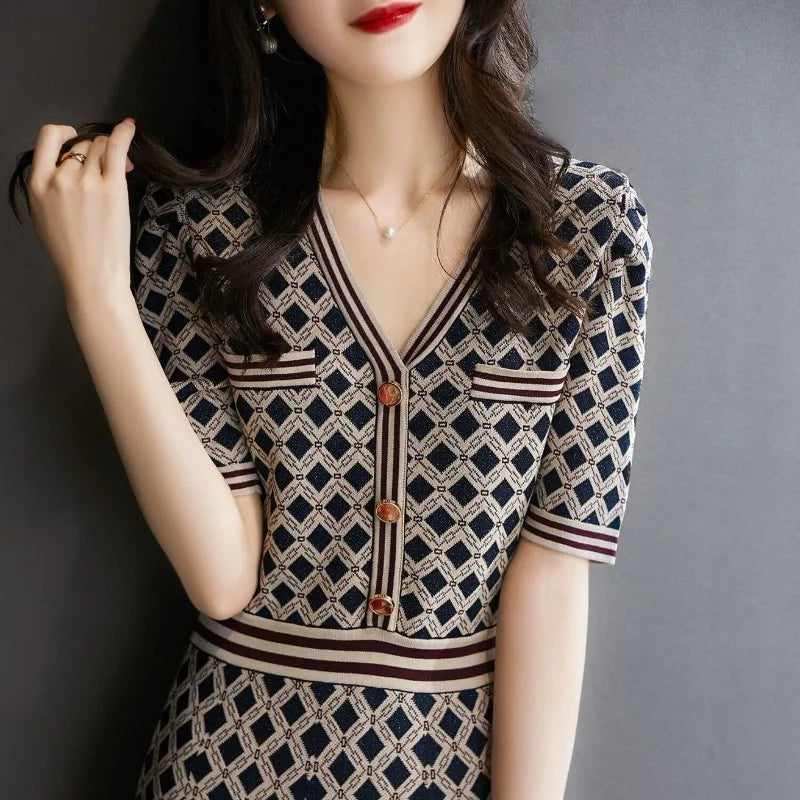 Woman wearing a patterned dress with a gray background