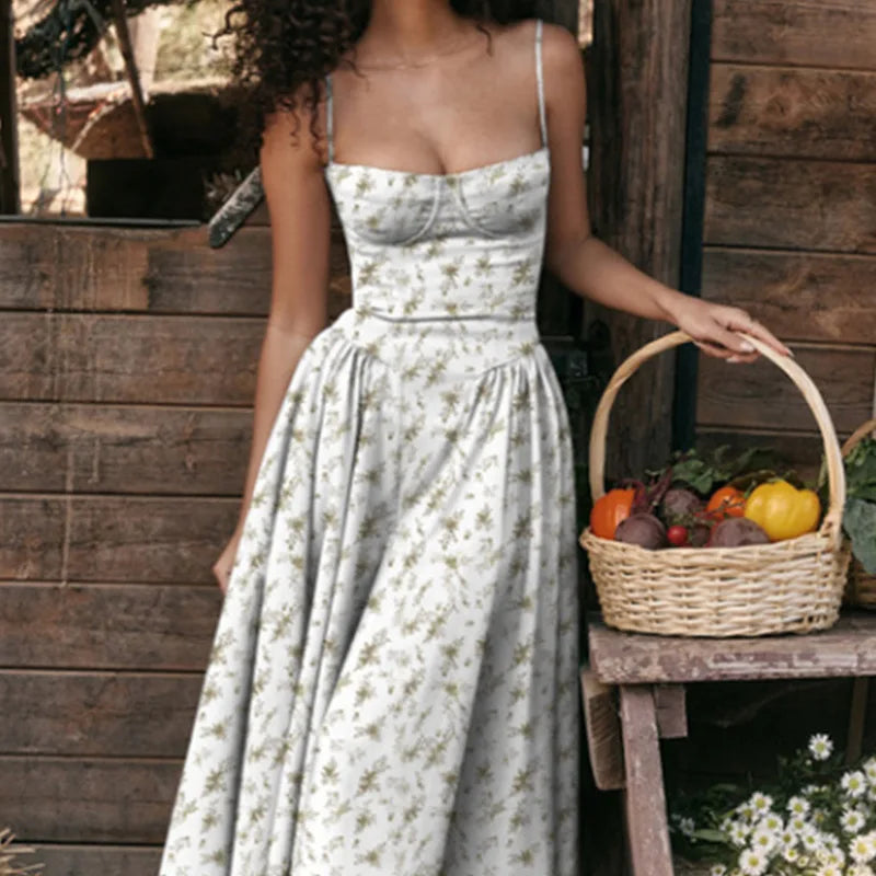 Woman in a floral dress holding a basket of vegetables against a wooden wall.