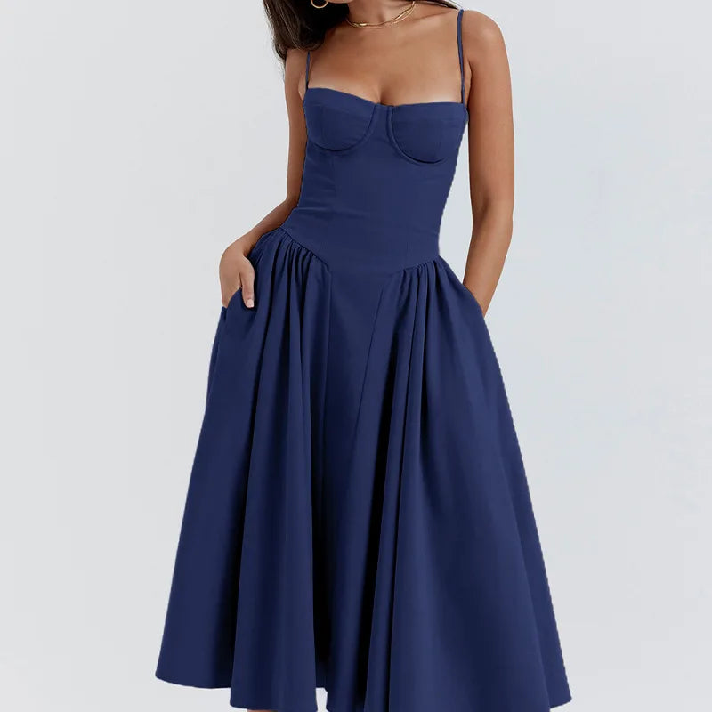 Navy blue dress worn by a person on a white background