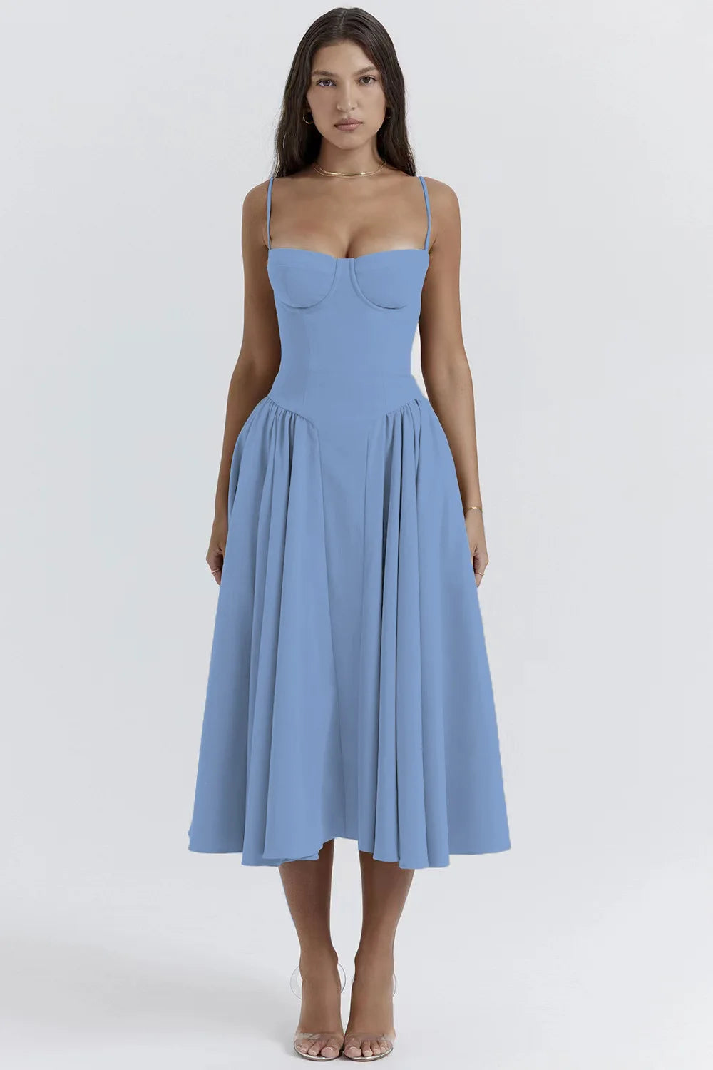 Woman wearing a light blue dress on a white background