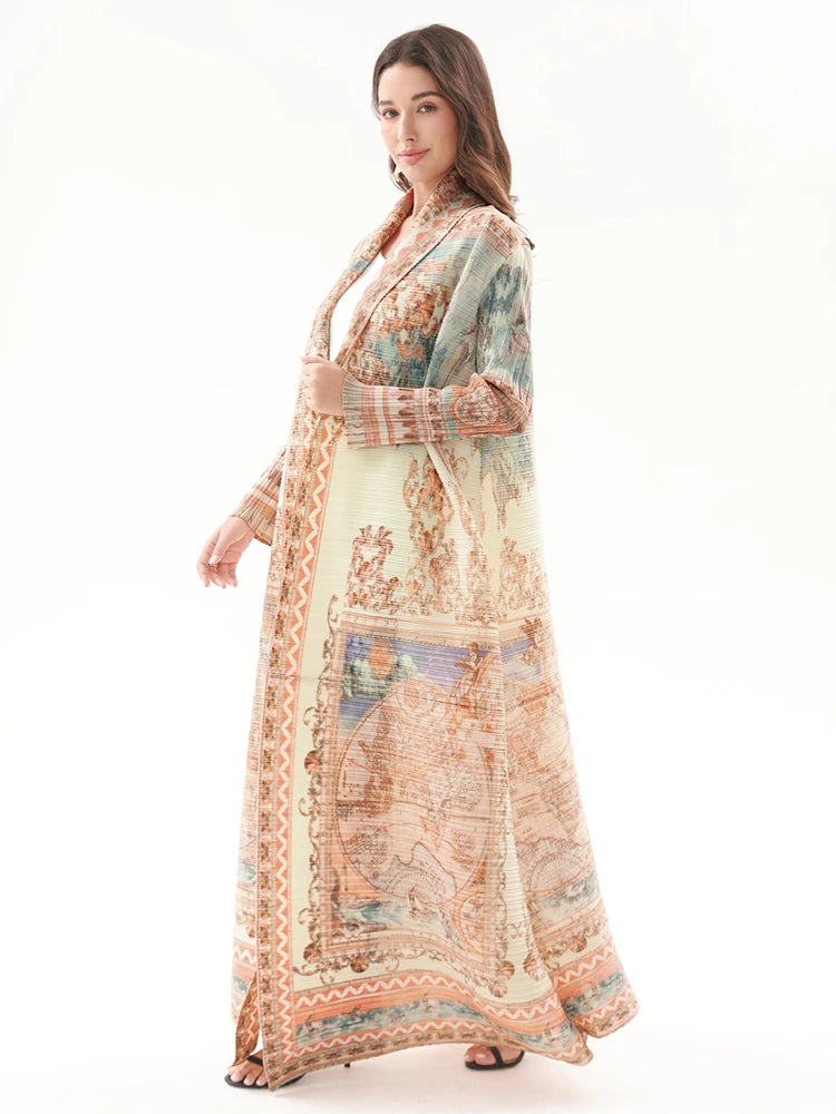 Woman wearing a long, patterned dress on a white background