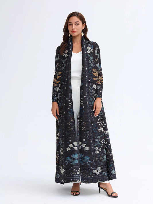 Woman wearing a long floral-patterned coat on a white background